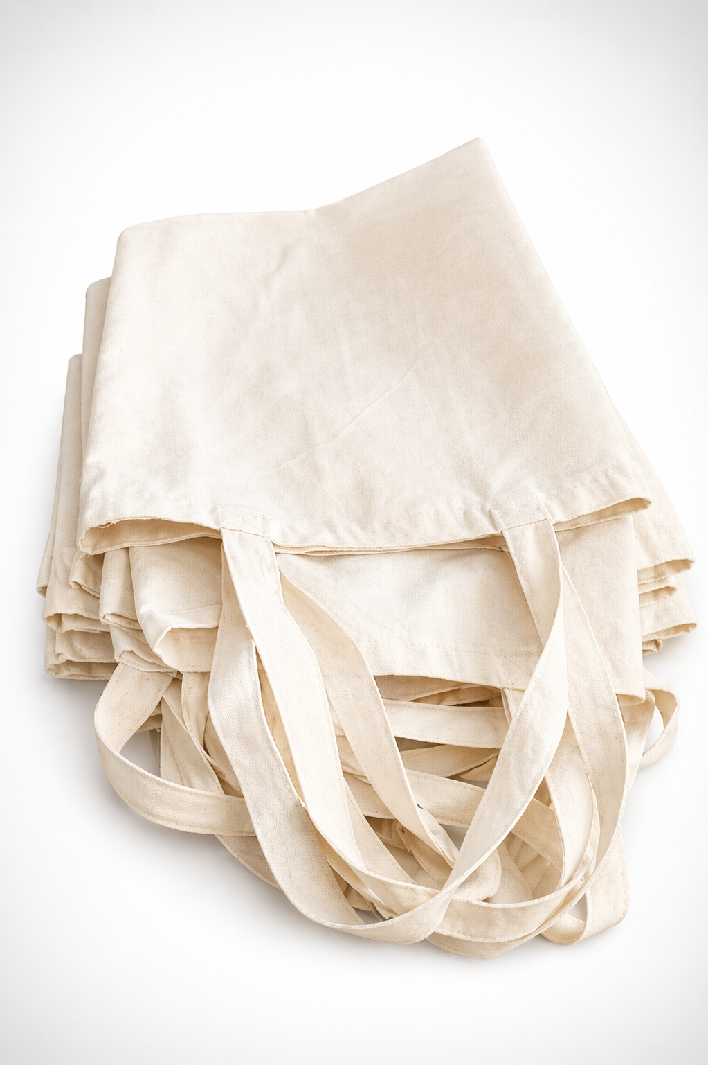 Stack of folded canvas tote bags